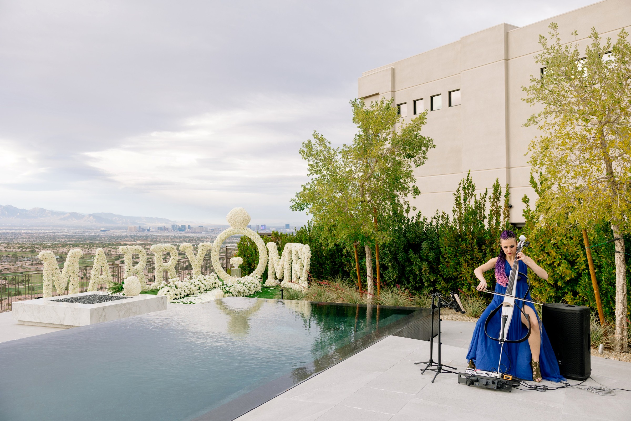 Elenka playing cello at a rooftop Marry Me proposal in Las Vegas